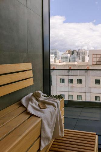 a towel sitting on a bench on a balcony at Sonder by Marriott Bonvoy Maisonneuve Apartments Downtown in Montréal