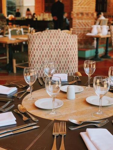 a table with wine glasses and silverware on it at Sheraton Pilar Hotel & Convention Center in Pilar