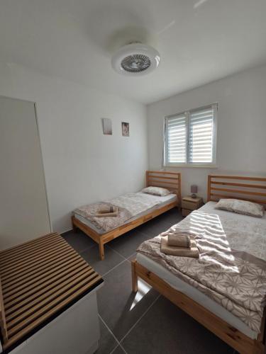 Postel nebo postele na pokoji v ubytování Apartman M & M, Schöne Wohnung nur 200m vom Strand