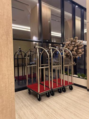 a display case with three iron racks in a building at Regency View Hotel in Al Madinah