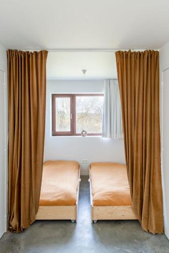 Postel nebo postele na pokoji v ubytování KAMP ZUID original getaway