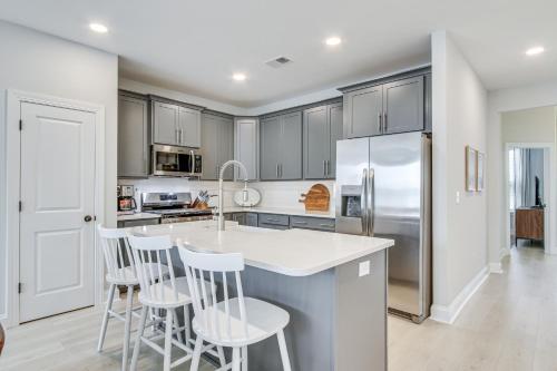 a kitchen with stainless steel appliances and white cabinets at Dock Access Pet-Friendly Lake Greenwood Gem! in Greenwood