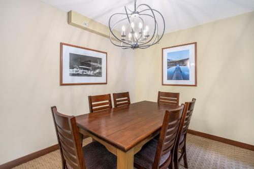a dining room with a wooden table and chairs at Horstman House by Whistler Premier in Whistler