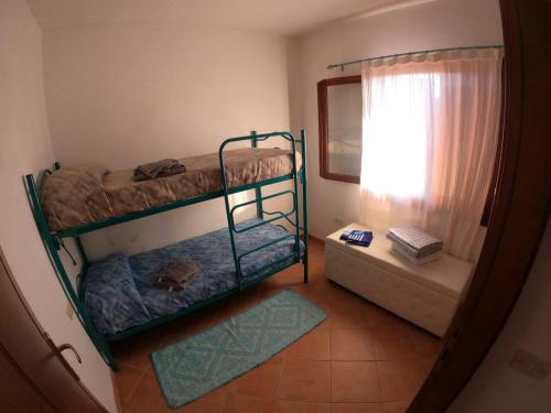 Postel nebo postele na pokoji v ubytování Appartamento Alfieri a Porto San Paolo