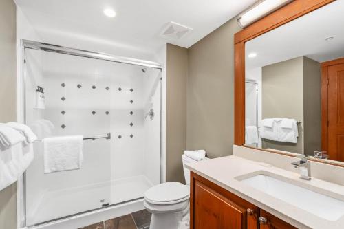 a bathroom with a shower and a toilet and a sink at Horstman House by Whistler Premier in Whistler