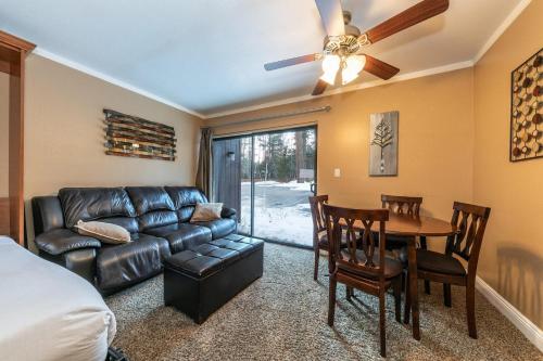 a living room with a couch and a dining room table at Cozy Deluxe Studio #131 at Donner Lake Village condo in Truckee