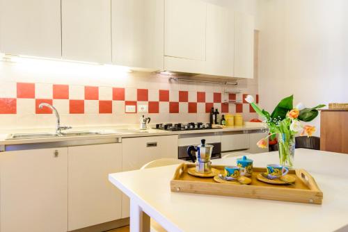 a kitchen with a wooden tray on a counter at Casa di Zia Rosaria SEA VIEW in Vietri sul Mare