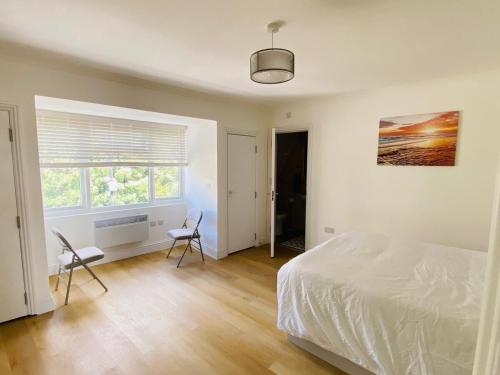 Ένα ή περισσότερα κρεβάτια σε δωμάτιο στο Easy Lodge Hounslow West