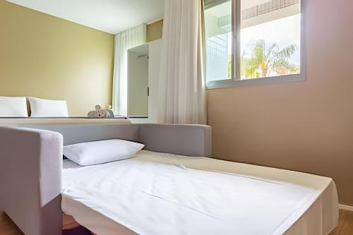 Ένα ή περισσότερα κρεβάτια σε δωμάτιο στο Studio Charme Central Park