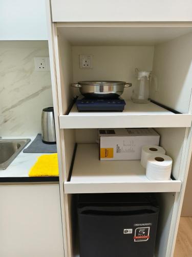 a cupboard with a bowl on top of it at Unisuites Kampar COZY 1 BR 4pax in Kampar