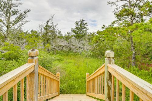 a wooden walkway with two wooden posts on it at Hot Tub Haven Creekside Cabin in Frisco! in Frisco