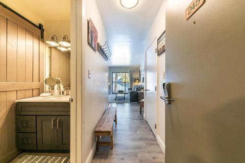 a hallway of a kitchen with a sink and a table at 245 Bldg C condo in Truckee