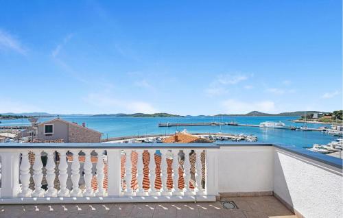 a balcony with a view of a marina at 1 Bedroom Beautiful Apartment In Vodice in Vodice