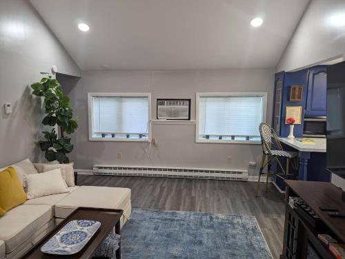 a living room with a couch and a table at Secluded Getaway Near Downtown, Airport, Hospitals in Pittston