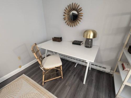 a white table and chairs in a room with a mirror at Secluded Getaway Near Downtown, Airport, Hospitals in Pittston