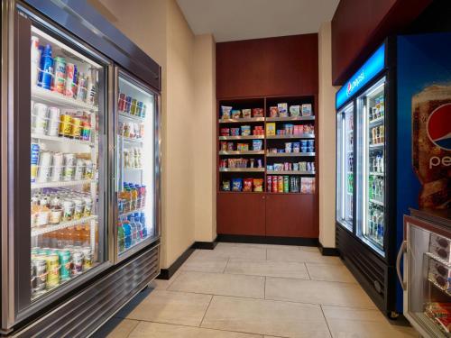 an aisle of a store with two refrigerators at Courtyard Culver City Los Angeles in Los Angeles