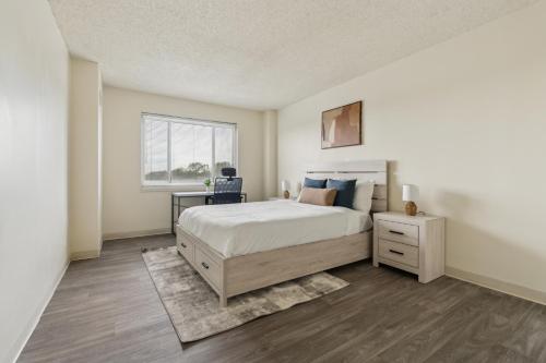 a bedroom with a large bed and a window at Legacy At Imperial Village 712 I 1 Bed 1 Bath in Richmond