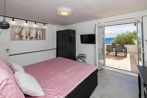 Postel nebo postele na pokoji v ubytování Apartman Alma