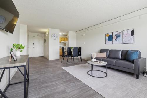 a living room with a couch and a table at Legacy At Imperial Village 712 I 1 Bed 1 Bath in Richmond