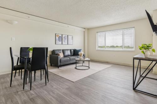 a living room with a couch and a table at Legacy At Imperial Village 712 I 1 Bed 1 Bath in Richmond