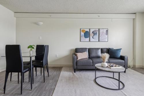 a living room with a couch and a table at Legacy At Imperial Village 712 I 1 Bed 1 Bath in Richmond