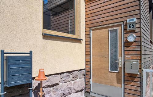 a door to a building with a window and a window at Nice Apartment In Steinbach-Hallenberg in Kurort Steinbach-Hallenberg