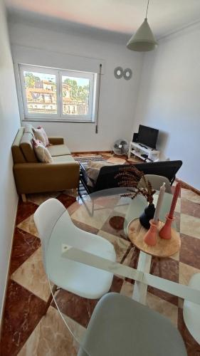 a living room with a couch and a table at Li-miana Alojamento Local in Ponte de Lima