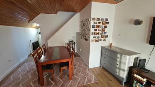 a dining room with a table and a dresser at Ciao Bambino! in Fonyód