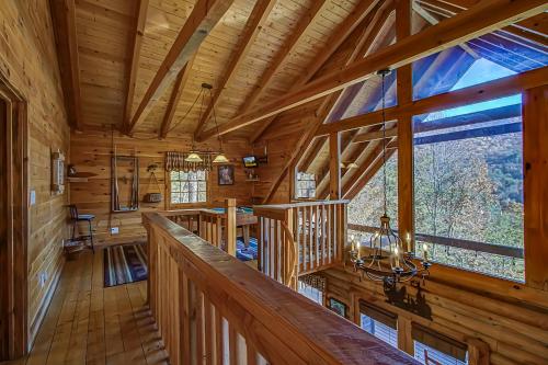 a large room with wooden ceilings and a large window at Walden's View in Sevierville