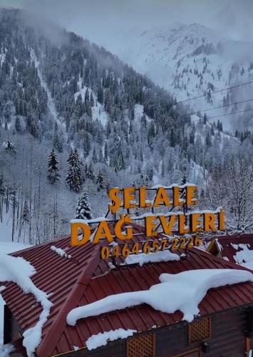 a sign on the roof of a shillelle dazov ski resort at Ayder Villas in Çamlıhemşin