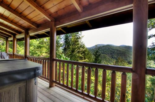 a screened in porch with a view of the mountains at Bears Up There in Sevierville
