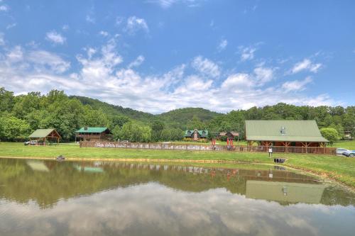 a view of a lake with a building in the background at Bears Up There in Sevierville