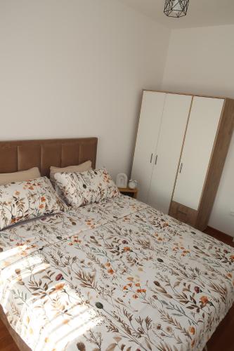 Ένα ή περισσότερα κρεβάτια σε δωμάτιο στο Lumière Apartment