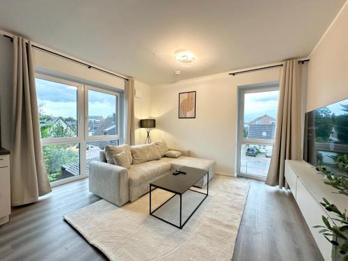 Harmony Homes - Nähe Bahnhof - Terasse - Smart-TV - Nähe Hamburg & Flughafenにあるシーティングエリア