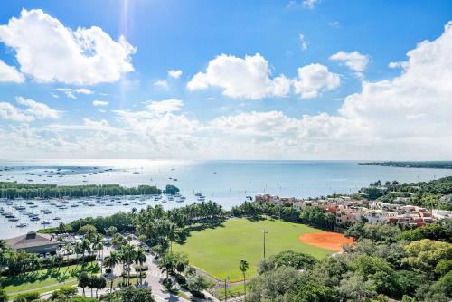 an aerial view of a harbor with boats in the water at MVR - Elevate Your Stay with Stunning Ocean Views in Miami