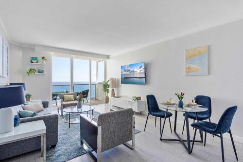 a living room with a couch and a table and chairs at MVR - Sunsets So Good You-ll Book Twice in Miami