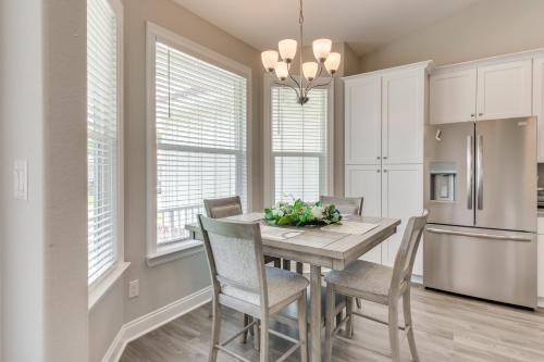 a kitchen with a dining room table and chairs at Modern Family Home with Spacious Yard in Milton in Ferry Pass