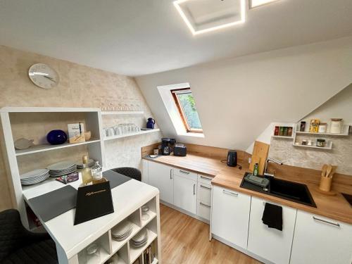 Kuchyň nebo kuchyňský kout v ubytování Fewo Sobierajczyk Graal-Müritz Studio