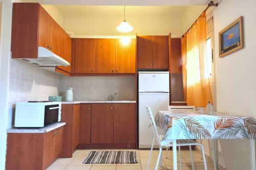 Η κουζίνα ή μικρή κουζίνα στο Casa Evriali Apartments