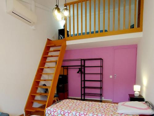 a room with a bunk bed and a staircase at Chambres "Chez ELLE" in Oraison