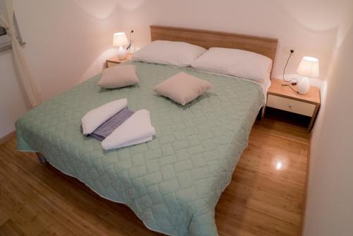 Postel nebo postele na pokoji v ubytování Apartmani Ružica