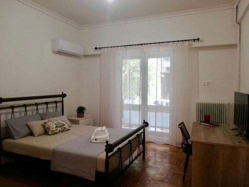 Ένα ή περισσότερα κρεβάτια σε δωμάτιο στο Modern Studio for 2 persons in the Heart of Athens