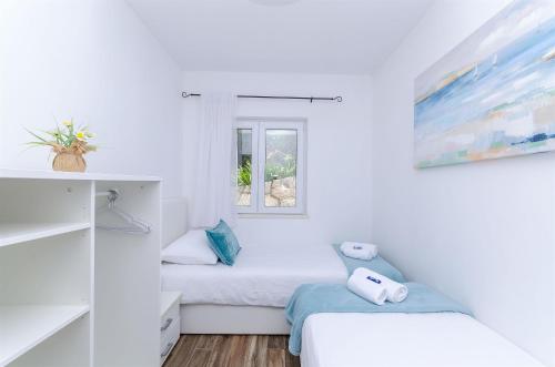 Posteľ alebo postele v izbe v ubytovaní House Kuca za odmor Herta