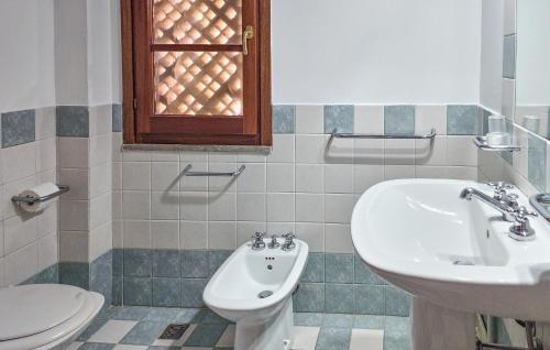 a bathroom with a sink and a toilet at Gorgeous Apartment In Montone in Montone