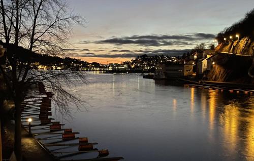 a river with a bunch of boats in the water at 2 Bedroom Cozy Home In Arendal in Arendal