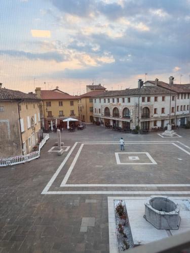 an empty parking lot in a town with buildings at Locanda ai Provveditori in Marano Lagunare