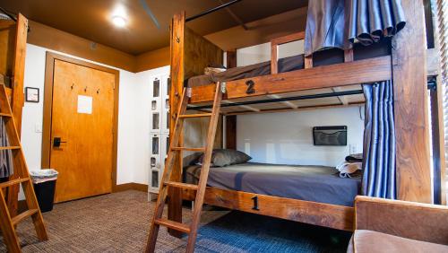 a bedroom with two bunk beds in a room at Park City Hostel in Park City