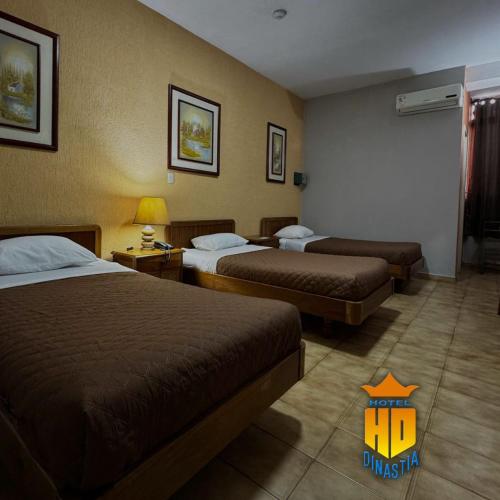 Postel nebo postele na pokoji v ubytování Hotel Dinastía