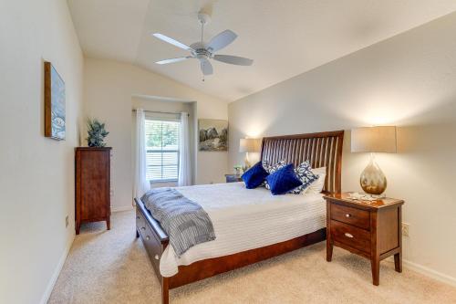 a bedroom with a bed and a ceiling fan at Less Than 1 Mi to Brownwood Paddock Square Home with Patio! in The Villages