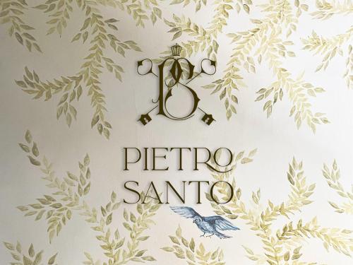 a sign with a picture santao on a wall at Hotel Pietro Santo in Santeagueda